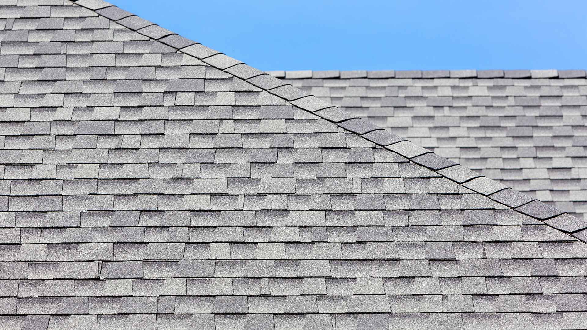 asphalt shingles roof close up at residential property with sky at the back canton ms